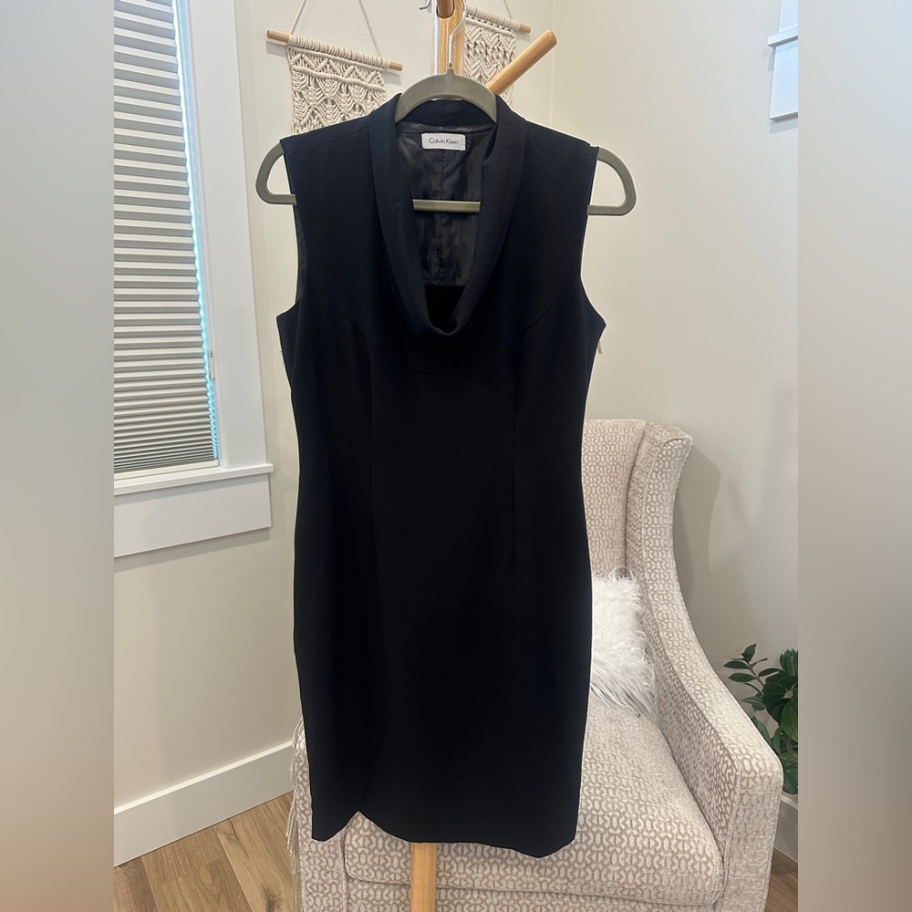 Calvin Klein Black Sleeveless Sheath Dress with side zipper details.